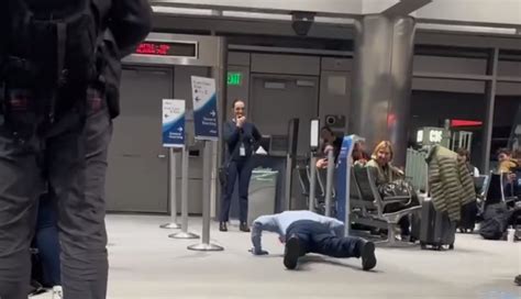 Watch: Delayed flight leads to employee push-up contest at DIA
